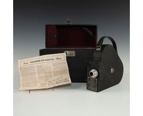 Vintage film camera with classic styling.The Cine-Kodak model E movie camera 16mm was introduced with a shape similar to the 