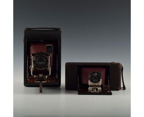 Antique Kodak, Ansco bellows cameras decked in mahogany/leather.Kodak No. 4 Folding Pocket Model B featuring pneumatic shutte