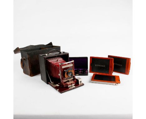 Rich wood and leather camera; film holders, case, box of filters.The Conley Model 15 is a well-made mahogany and leather, tra