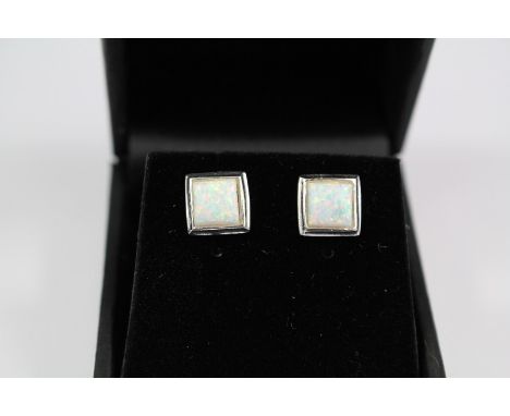 A Pair of Silver and Opal Stud Earrings, the opals measure 6 x 6 mm.