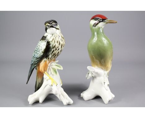 Two Continental Porcelain Birds; the first being a Green Woodpecker perched on a branch, approx 26 cms h, together with a Fal
