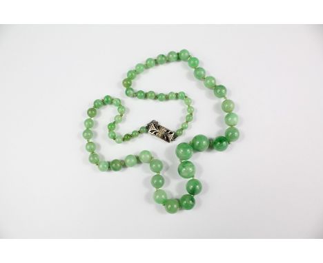 A Chinese Graduated Jade Necklace, approx 38 cms, beads measure approx 3mm to 7mm on an 18ct white gold and diamond clasp.&nb