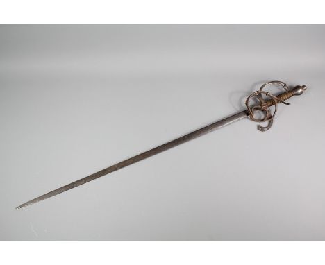 A 16th Century Swept Hilt Rapier, the blade is 80 cms, with wire grip and iron pommel.Note: This sword comes with a letter of