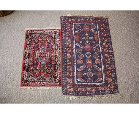 Two Small Woollen Carpets, the first having jewel colours hand-woven in Iran approx 60 w x 95 l cms, the second a hand-woven 