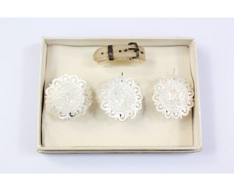 A Set of Three Mother of Pearl Buttons, together with a mother scarf ring. (4)
