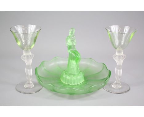 Walther &amp; Sohne Green Uranium Glass Lamp, depicting a feminine nude supporting a flaming torch, approx 43 cms h together 