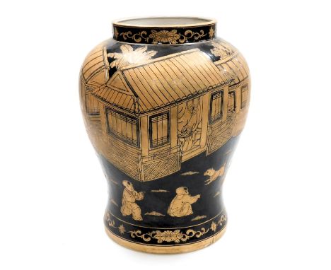 A 20thC Chinese famille noire vase, of baluster form, decorated with children playing in a garden, red four character mark, 3