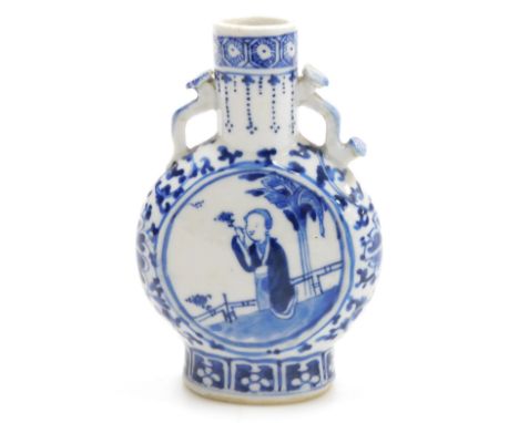 A Qing dynasty blue and white porcelain moon flask, decorated centrally with figures in a garden within a floral ground, Qian