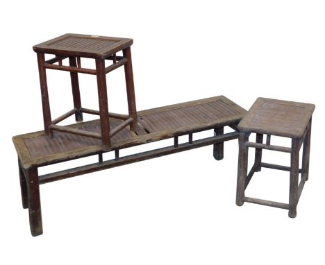 A Chinese elm and bamboo slatted bench, 42cm high, 126cm wide, 35.5cm deep, together with two similar stools.  (3)