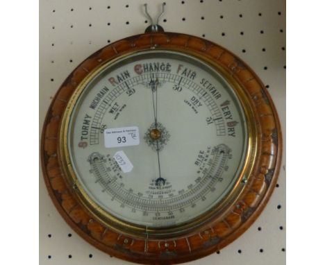 Carved oak framed aneroid barometer, together with a copper warming pan (2)