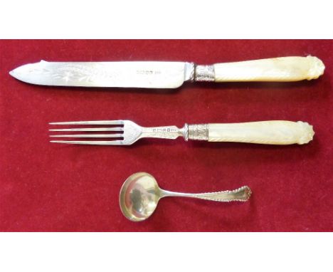 A Victorian silver and mother of pearl handled serving knife and fork Sheffield 1851, and a silver sauce ladle London 1988