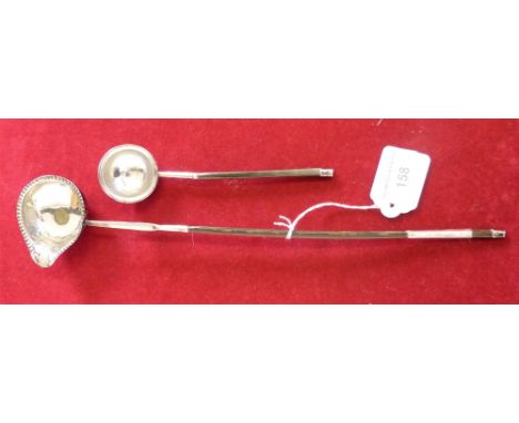 A George III silver toddy ladle, with whalebone handle dated 1773 and another with an electroplated bowl (2)