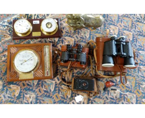 Two pairs of cased binoculars - Syma 12x50, Otto Walter together with a folding vintage camera, wall mounted barometers and a