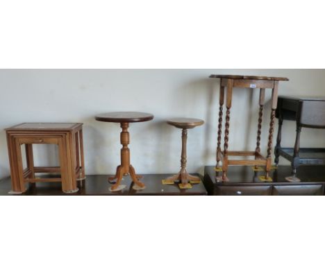 An Eastern carved teak nest of four graduated occasional tables, Ercol dark stained elm drop-leaf trolley, oak barley twist o