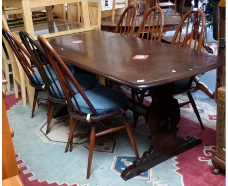 An Ercol stained elm refectory style dining table, 183cm wide and set of six Ercol stick-back chairs (7)