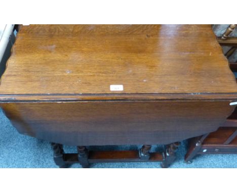 An oak barley twist gate-leg tea table, with wavy edge, 76cm wide, 105cm extended