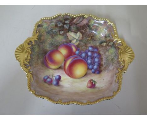 A Royal Worcester fine bone china dish with fruit still life on a mossy bank signed H Ayrton with gilt borders and shell hand