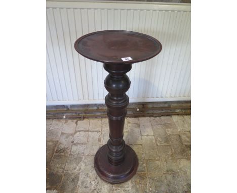 A mahogany pedestal plant stand, 86cm tall x 33cm diameter 