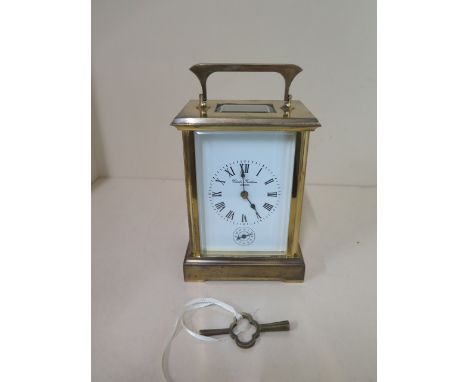 A large brass cased carriage clock with French movement, 8 day with hour / half hour strike also has alarm settings, retailed