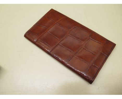 A Vintage crocodile skin gentleman's wallet with leather interior, 18cm x 10cm when closed, in good condition, some usage mar