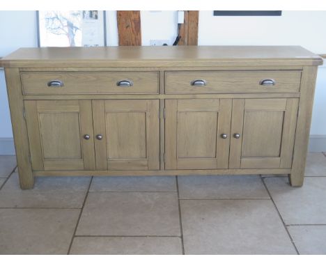 A good quality oak sideboard with two drawers and four cupboard doors, as new RRP £600, 200cm long x 90cm high x 46cm depth 