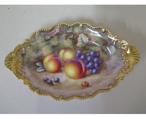 A Royal Worcester oval fine bone china dish with fruit still life on a mossy bank signed H Ayrton with gilt border and shell 