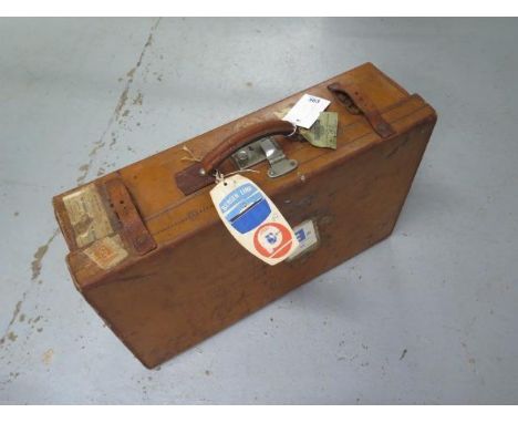 A vintage leather suitcase with travel labels - 62cm x 38cm x 18cm 