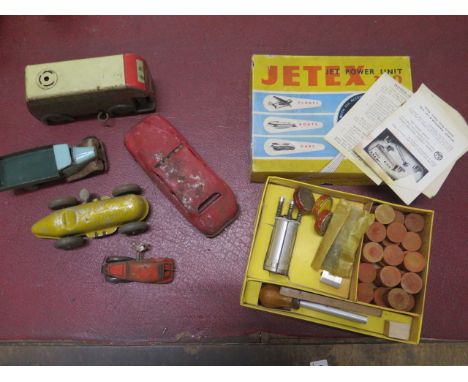 Five tinplate toys and a Jetex 350 engine, boxed, tinplate toys all worn or rusted, dented 