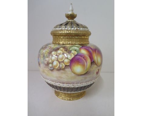A Royal Worcester fine bone china pot pourri vase and reticulated cover with fruit still life signed Freeman with basket weav
