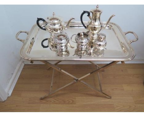 A large Cesa 1882 silver plated tray on a folding plated stand with an Arthur Price plated four piece tea service and a plate