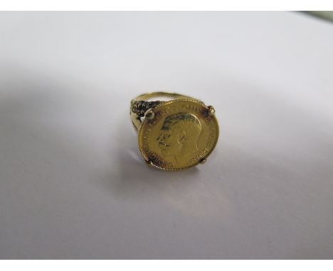 A George V gold half sovereign, dated 1914, in a 9ct gold ring set, size N/O, approx 9.9 grams 