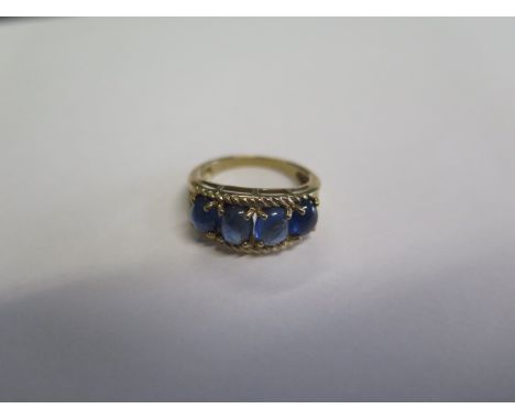 A 9ct hallmarked yellow gold cabochon five stone sapphire ring size N - approx weight 3.9 grams - in good condition, please n