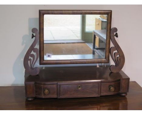 An early 19th century mahogany toilet mirror with three drawers - height 50cm x 60cm x 25cm 