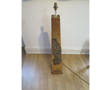 A beautiful gold covered obelisk shaped lamp with defined intricate pattern and floral design in relief, height 104cm, in goo