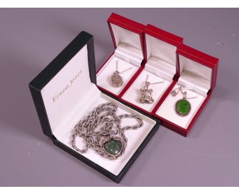 FOUR VINTAGE NECKLACES in presentation boxes to include a heart form pendant with cased green agate stone on a rope twist cha