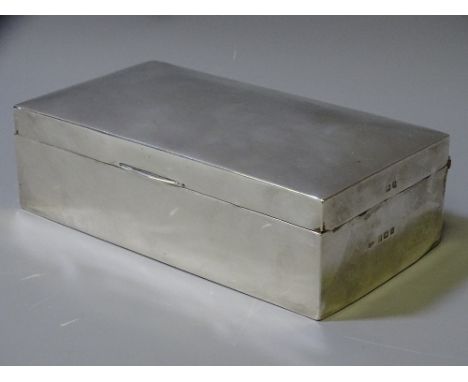 AN OBLONG WOODEN CIGARETTE BOX, silver mounted throughout, Birmingham 1911 by H W Williamson