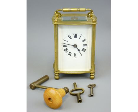 FRENCH BRASS CARRIAGE CLOCK with winding key and others having Roman numerals set to a white enamel dial (cracked), 14cms H h