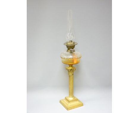VICTORIAN OIL LAMP with clear glass facet cut font on a Corinthian column brass base, 79cms overall H top of funnel