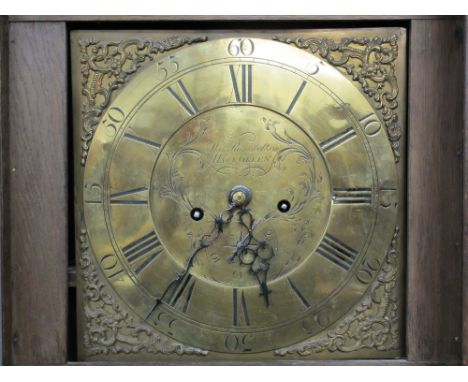 THOMAS RAMSBOTTOM BRASS DIAL CARVED OAK LONGCASE CLOCK, 12in dial set with Roman numerals and chased decorated, signed 'Thoma