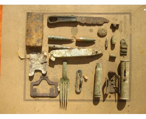 D DAY LANDING EXCAVATED RELICS- EX-FRENCH MUSEUM DISPLAY.    A board mounted with a selection of items picked up along the D-