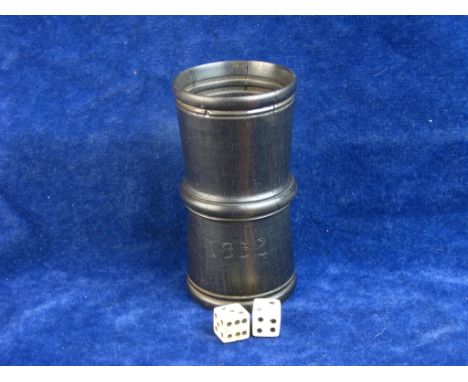 AMERICAN CIVIL WAR ERA.   A turned ebony dice shaker 3 ½ inches in height together with a pair of bone dice, dating from the 