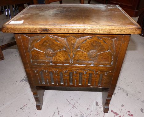A carved oak box stool