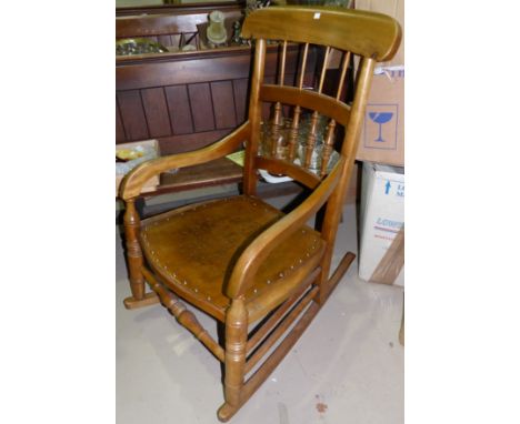 A 19th century beech stick back rocking armchair; a Windsor style stick back armchair