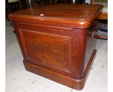 A Victorian mahogany box commode with hinged top and arms, and original pot