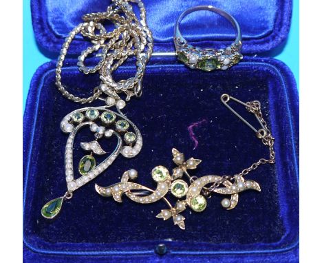 A suite of Edwardian seed pearl and peridot jewellery comprising Art Nouveau pendant on 9 carat hallmarked gold chain; ring s