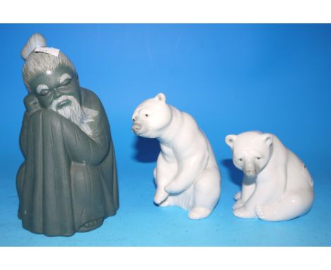 Two Lladro polar bear cubs; a Lladro figure of a Chinese man, 7"