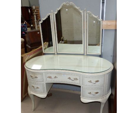 A period style cream and gilt kidney shaped dressing table and stool