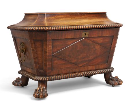A Regency mahogany cellarette, first quarter 19th century, of sarcophagus form, with gadrooned border, on paw feet and castor