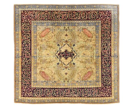 A Persian Kashan rug, third quarter 20th century, the central field with floral spandrels and Arabic calligraphy, on a beige,