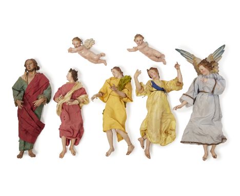 Seven Neapolitan polychrome decorated terracotta and wood creche figures, 19th century, comprising: four modelled as angels, 